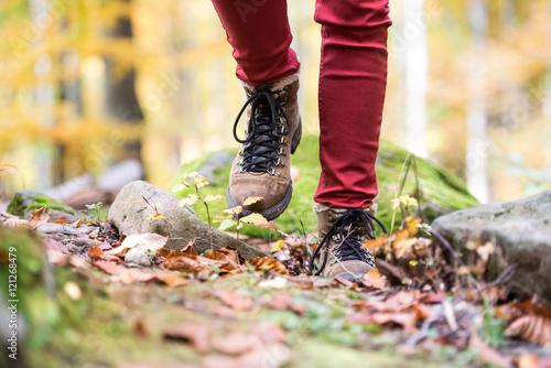 Close up of legs of unrecognizable woman in autumn nature