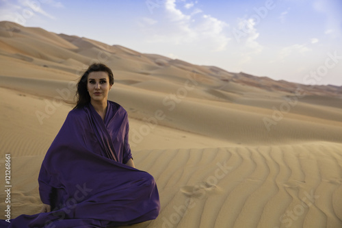 Anna taking a rest on a Dune in the Empty Quarter Desert