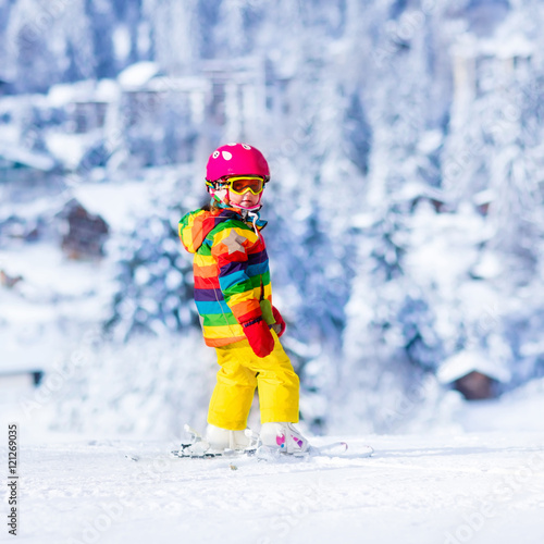 Wallpaper Mural Little girl skiing in the mountains Torontodigital.ca