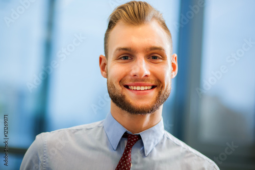 Portrait of a friendly businessman in his office