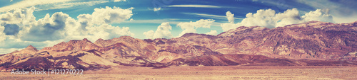 Vintage toned panoramic view of mountain range in Death Valley, USA.