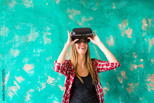 Young woman using the virtual reality headset © satura_