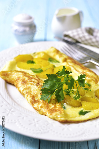 Omelet stuffed with potato and cheese.