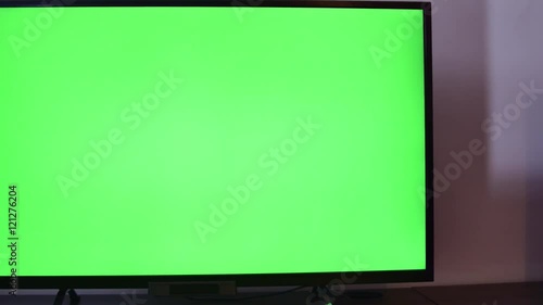 Pan Over A TV Set With Green Screen