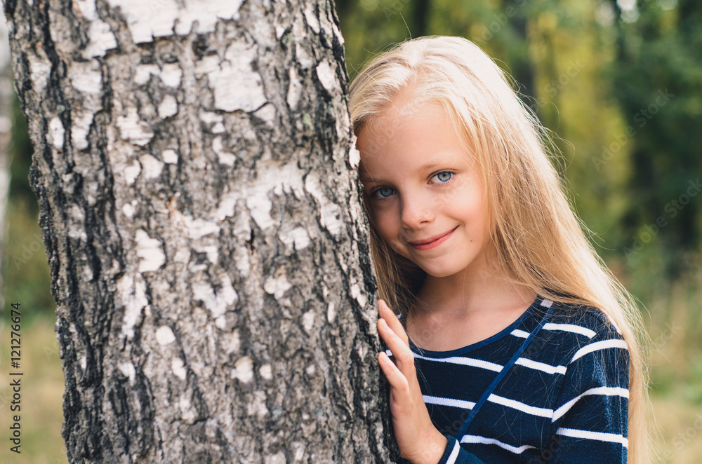 Cute Little girl portrait near tree birch. Cute Little girl portrait near tree birch.