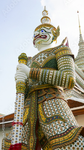 Bangkok - Thailand , September 3 - 2016 : Demon Guardian statues decorating the Buddhist temple Wat Arun in Bangkok, Thailand photo