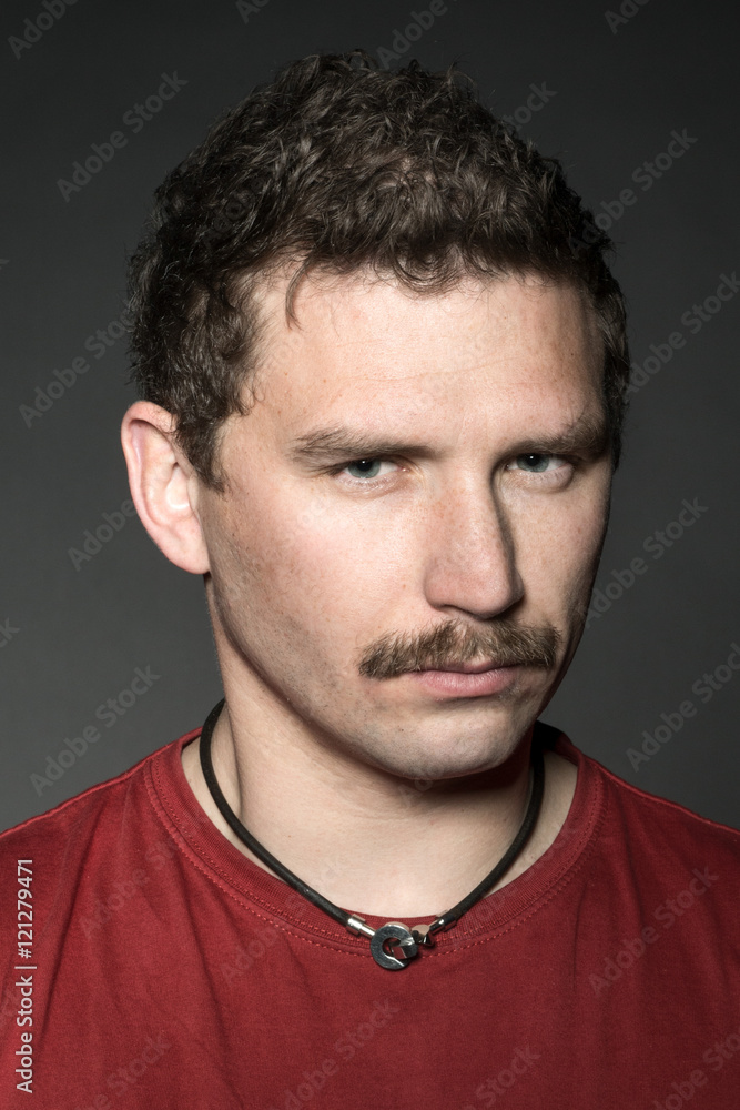 Fototapeta premium Young man with mustache