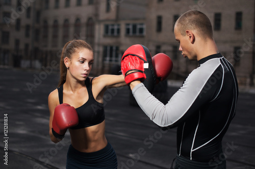 personal trainer coach men and women engaged in boxing at the stadium © rusvideo