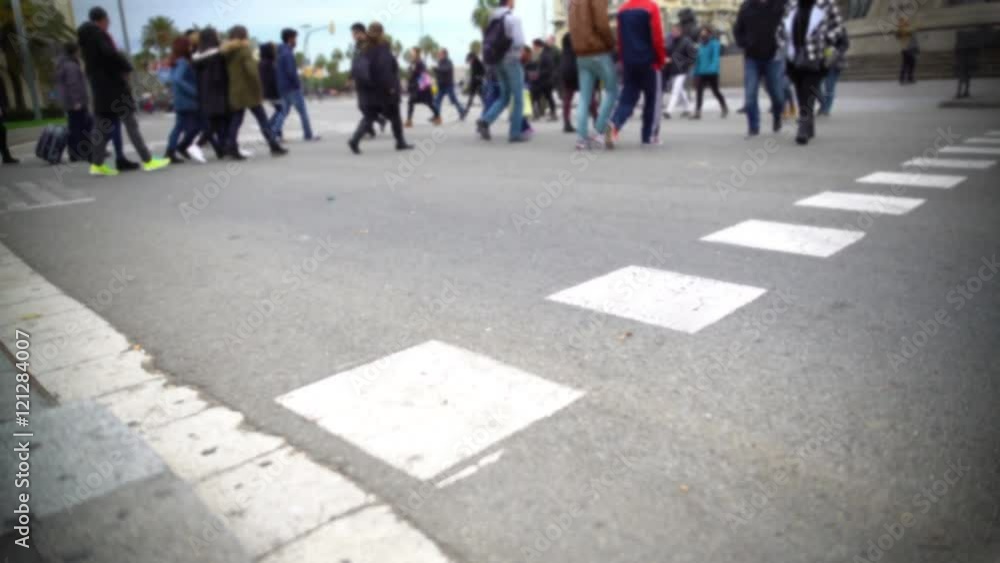 Crowd of locals and tourists crossing street, rush hour traffic, big city life Crowd of locals and tourists crossing street, rush hour traffic, big city life