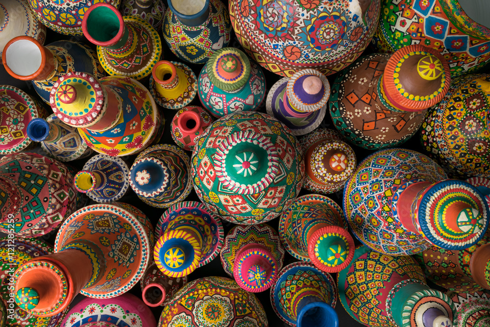 Composition of artistic painted handcrafted pottery jars