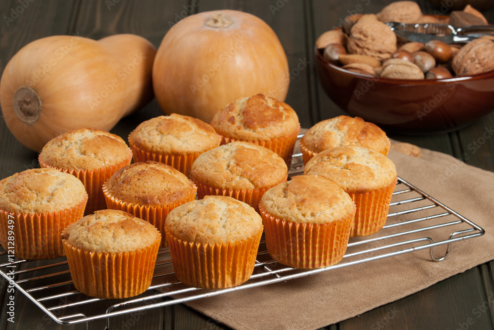 Homebaked Cupcakes In Paper Cases. Wooden Table. Pumpkins. Homebaked Cupcakes In Paper Cases. Wooden Table. Pumpkins.