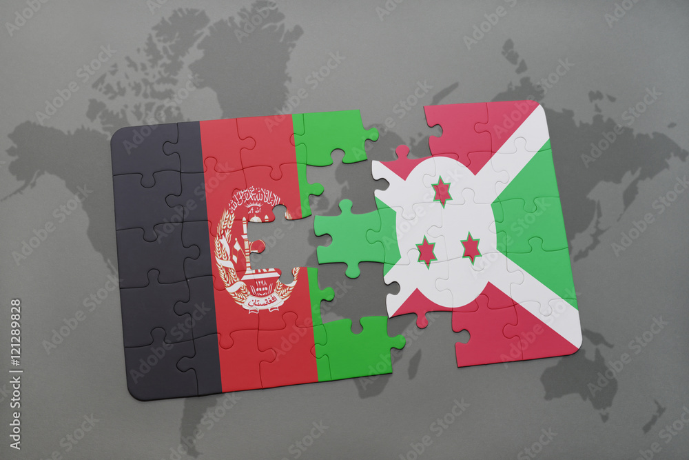 Obraz premium puzzle with the national flag of afghanistan and burundi on a world map background.