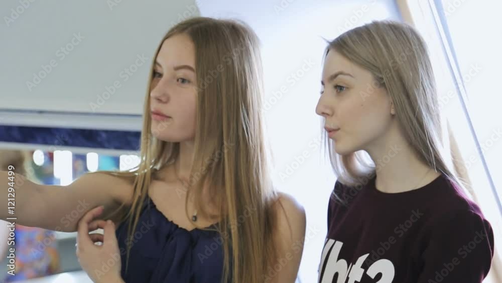 Young and beautiful women are making selfie in model school. Young and beautiful women are making selfie in model school.