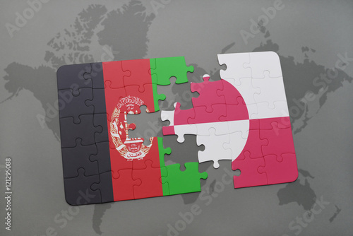 puzzle with the national flag of afghanistan and greenland on a world map background.