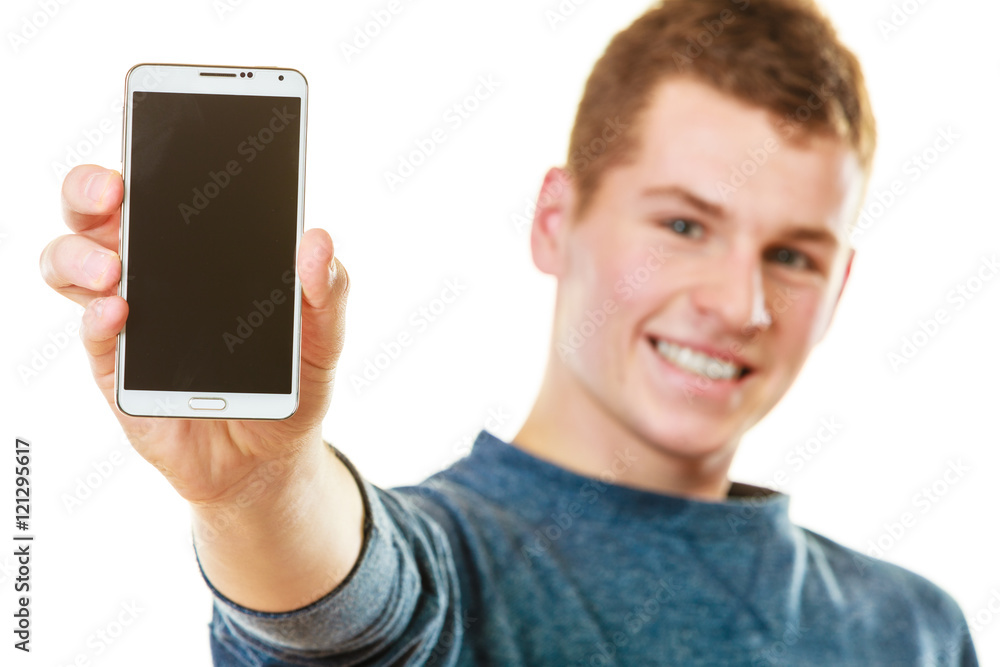 Young man showing black blank phone screen