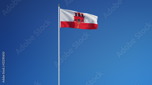 Gibraltar flag waving against clean blue sky, long shot, isolated with clipping path mask alpha channel transparency