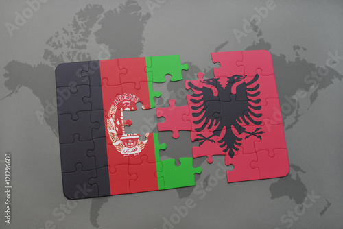 puzzle with the national flag of afghanistan and albania on a world map background.