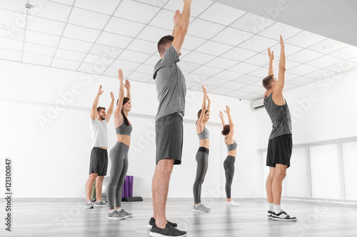 Group of people doing exercises in gym