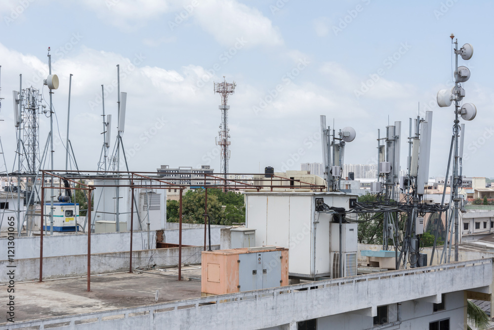 Cellular communications tower on a roof. Cellular communications tower on a roof.