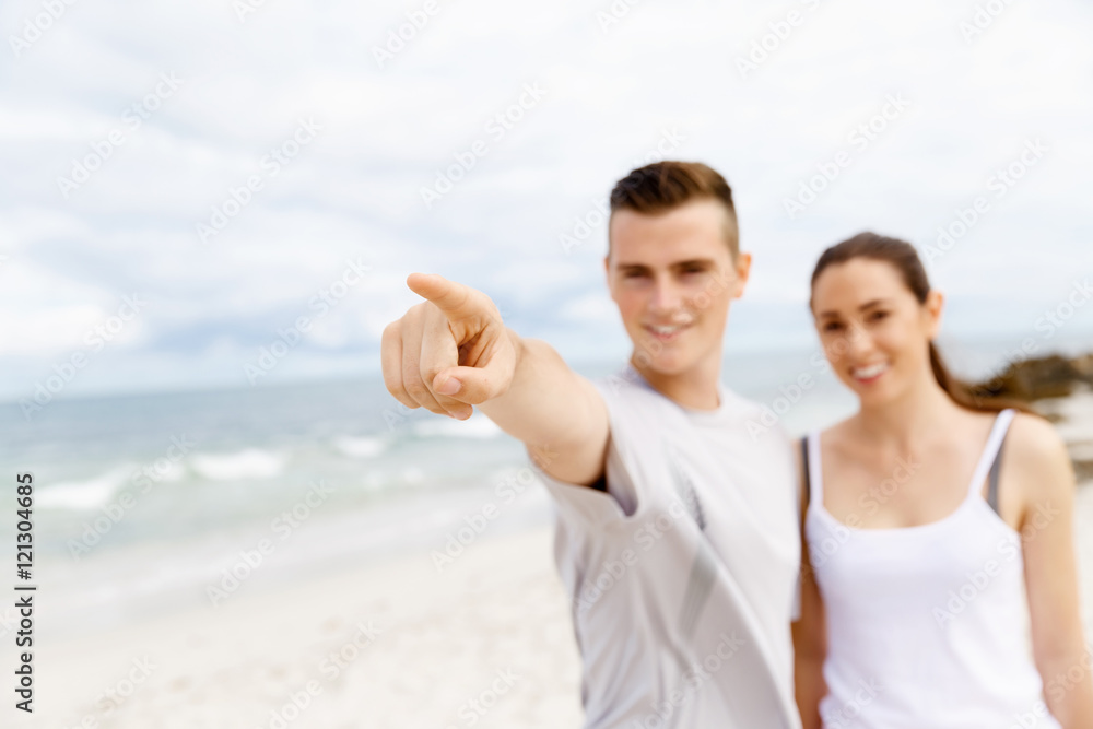 Couple of runners standing together on beach Couple of runners standing together on beach