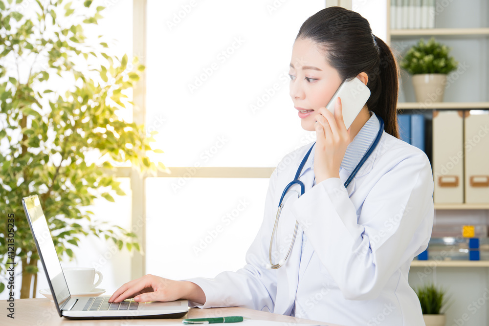 Doctor explain patient's condition by smart phone and computer Doctor explain patient's condition by smart phone and computer