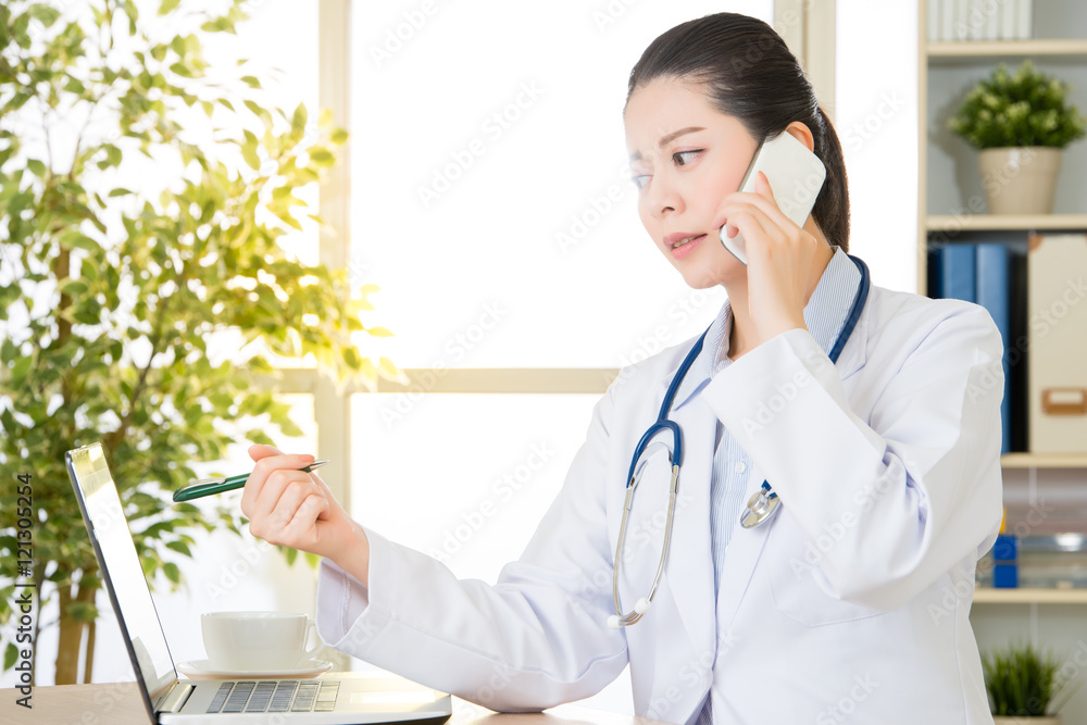 Doctor explain patient's condition by smart phone and computer Doctor explain patient's condition by smart phone and computer