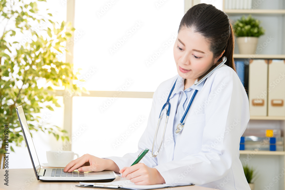 Doctor explain patient's condition by smart phone and computer Doctor explain patient's condition by smart phone and computer