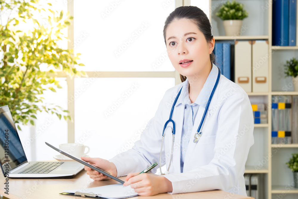 doctor using digital tablet to check patient's medical case doctor using digital tablet to check patient's medical case