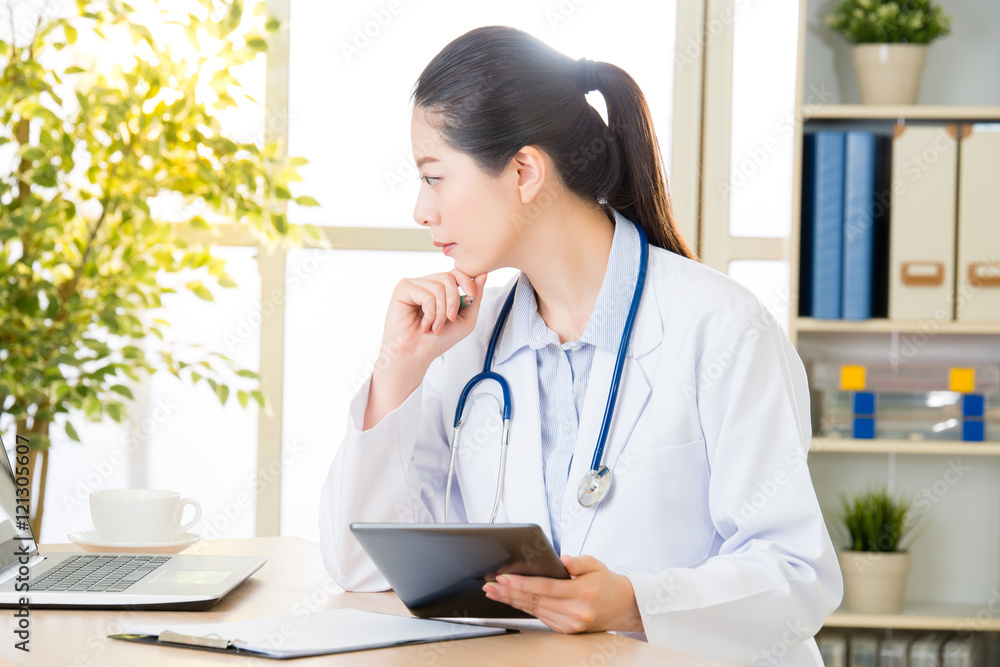 doctor drink coffee using digital tablet research patient's medi doctor drink coffee using digital tablet research patient's medi