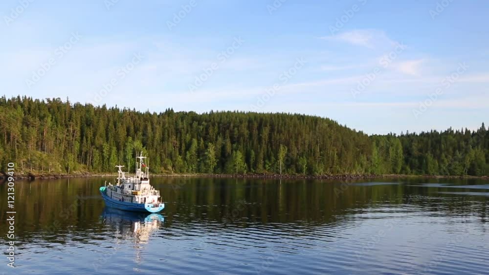 Passenger ship in the bay on the island of Valaam on Ladoga lake in northern Russia. Passenger ship in the bay on the island of Valaam on Ladoga lake in northern Russia.