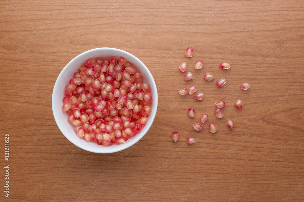 Ripe pomegranate fruit on wooden background Ripe pomegranate fruit on wooden background