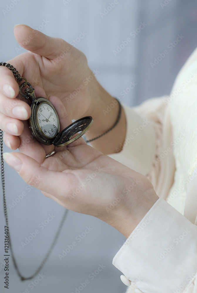pocket watch in the hands of women pocket watch in the hands of women