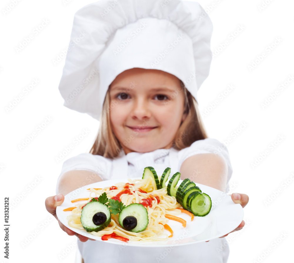 Little chef presenting a plate of pasta Little chef presenting a plate of pasta