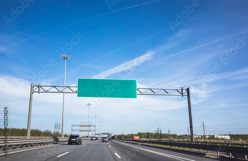 Green information banner over traffic lanes