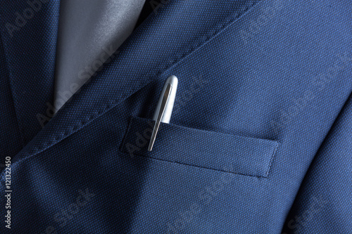 Pen in pocket of a business suit close up