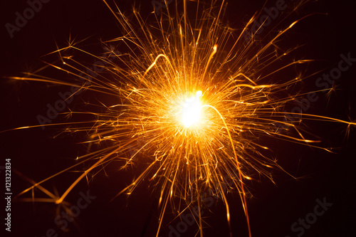 Orange burst of a sparkler close up