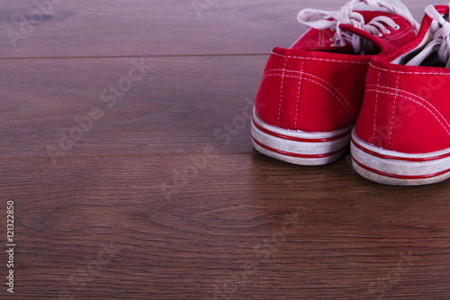 Old canvas shoes on a wooden floor © Christopher Hall