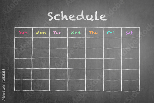 Timetable schedule on black chalkboard background