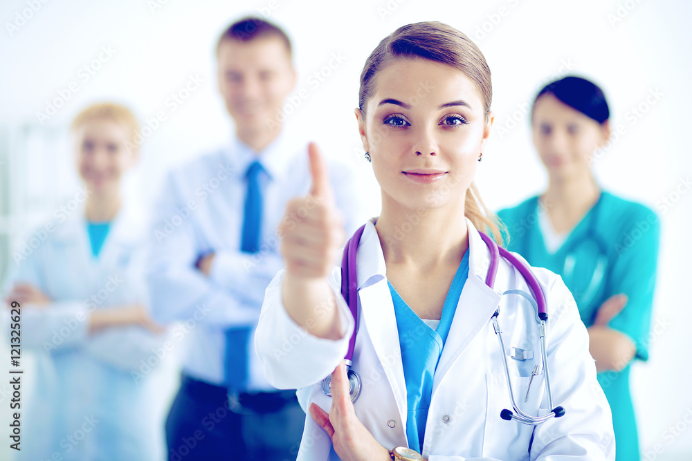 Young happy female doctor showing thumbs up Young happy female doctor showing thumbs up