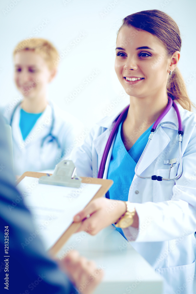 Medical team sitting at the table in modern hospital Medical team sitting at the table in modern hospital
