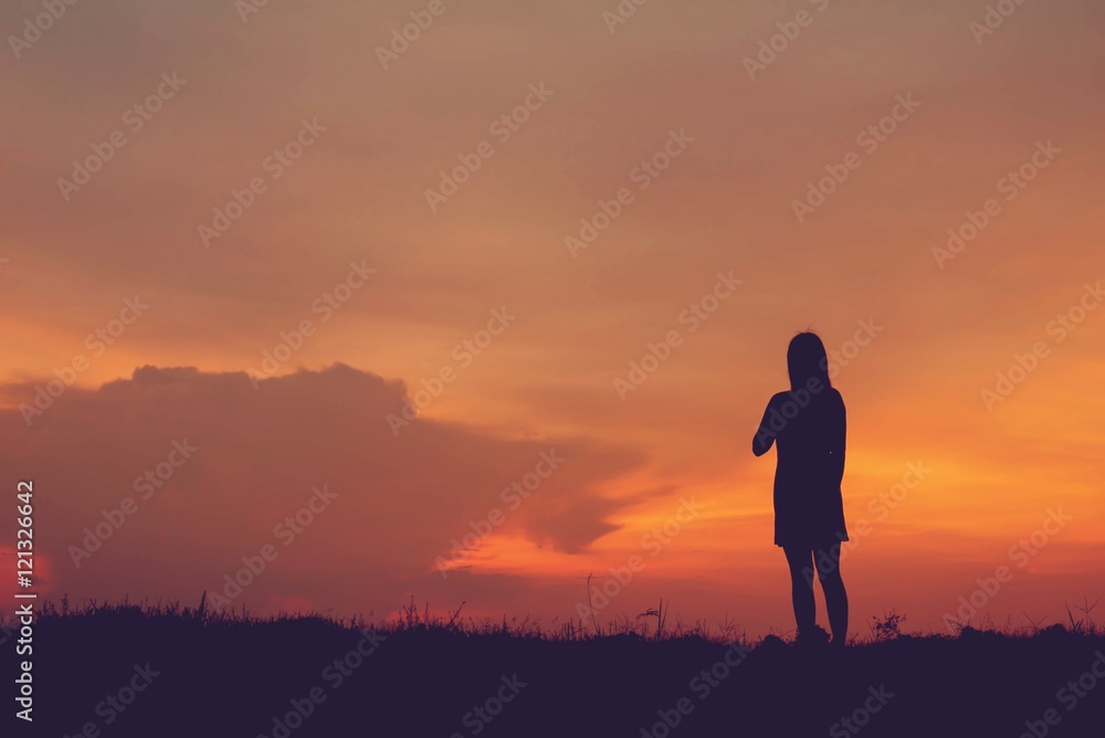 silhouette of woman enjoys outdoor at sunset silhouette of woman enjoys outdoor at sunset