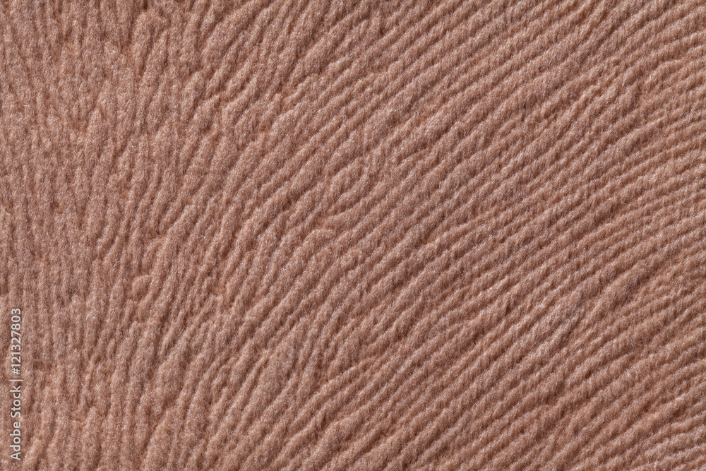Light brown background from soft textile material. Fabric with natural texture. Light brown background from soft textile material. Fabric with natural texture.