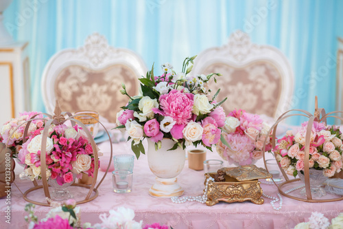 Table setting at a luxury wedding decorated with composition of