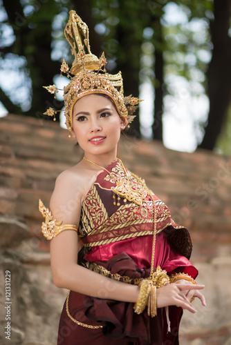 Beautiful asian woman portrait wearing typical thai dress with t