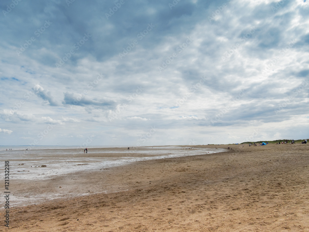 Dark clouds gather over an almost deserted Skegness beach in Lincolnshire