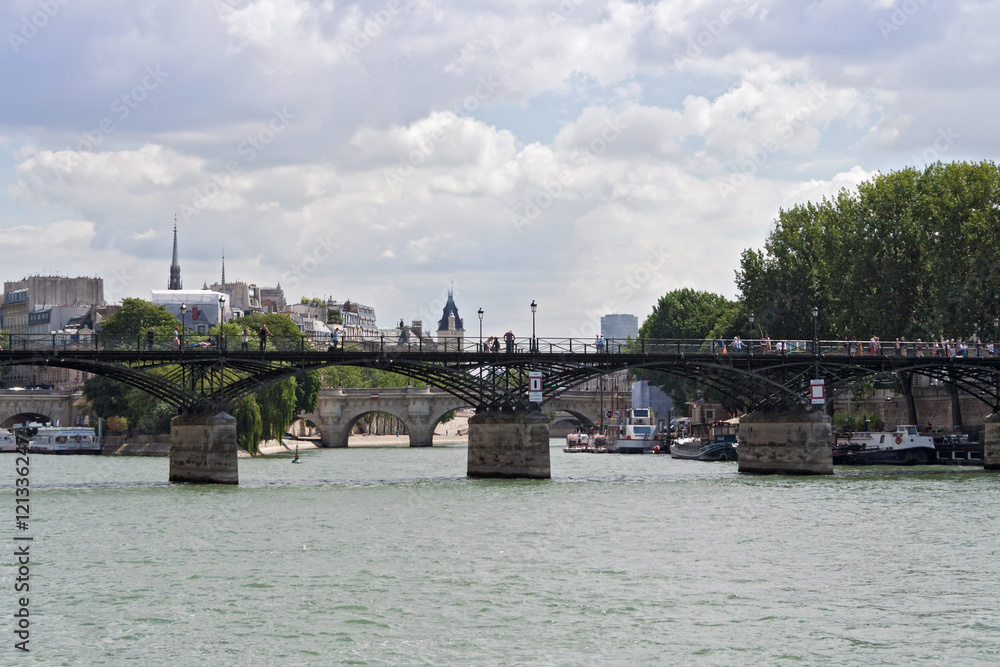 Fototapeta premium tourists on the seine bridge Pont des Arts in Paris