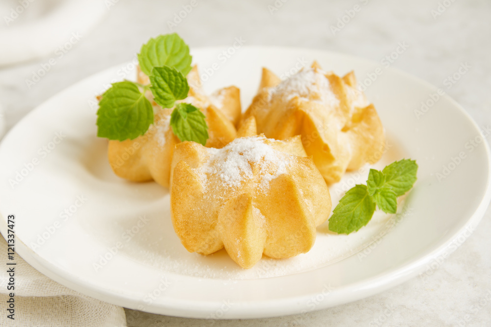 profiteroles with cream and powdered sugar profiteroles with cream and powdered sugar
