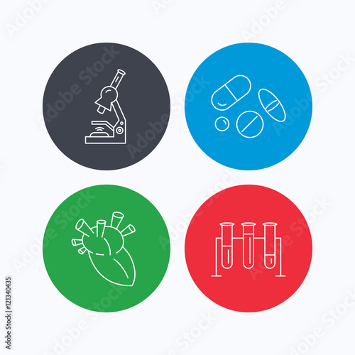 Microscope, medical pills and heart icons.