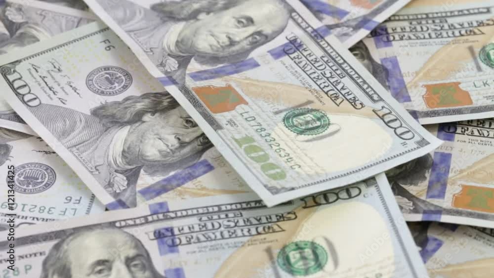 Rotation and falling paper money close-up. Background with money american hundred dollar bills Rotation and falling paper money close-up. Background with money american hundred dollar bills