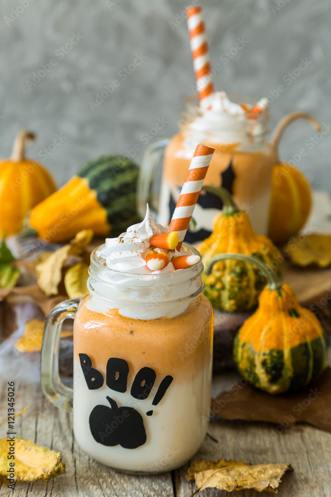 Halloween style pumpkin spice latte in glass jar